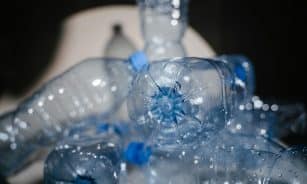 Detailed close-up of used plastic bottles ready for recycling, highlighting environmental impact.