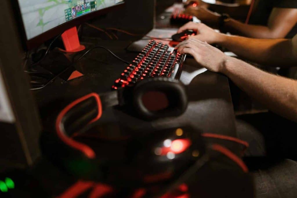 Close-up of gamers using mechanical keyboards during an intense esports session.