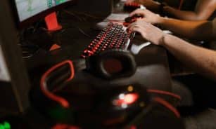 Close-up of gamers using mechanical keyboards during an intense esports session.