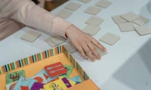 A child engages in a fun memory matching card game, showcasing focus and concentration.