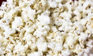 Delicious and fluffy popcorn kernels in a close-up shot ready to enjoy.