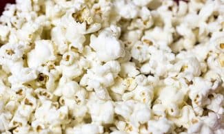 Delicious and fluffy popcorn kernels in a close-up shot ready to enjoy.