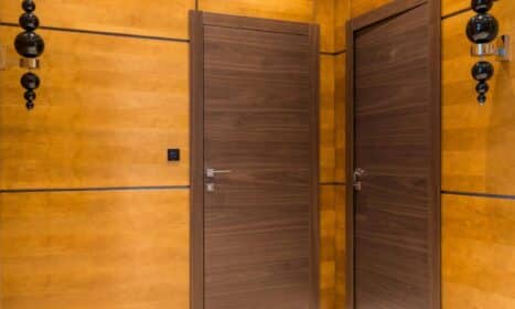 Elegant modern interior featuring sleek wooden paneling and contemporary doors.