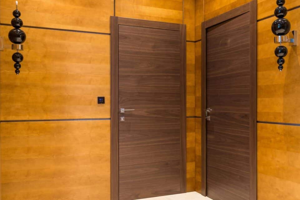 Elegant modern interior featuring sleek wooden paneling and contemporary doors.