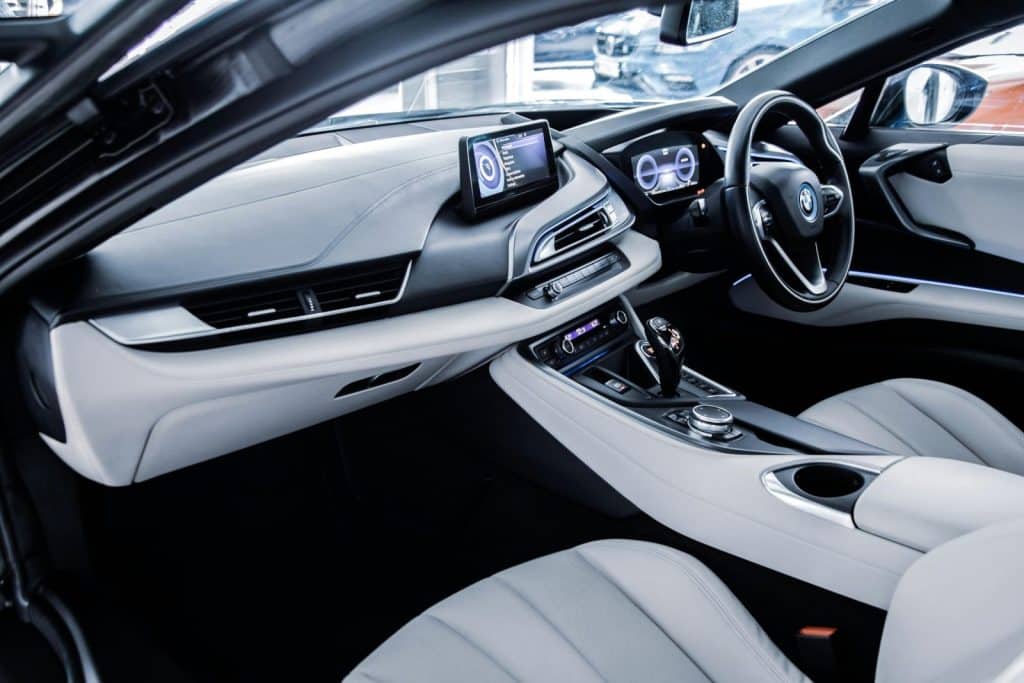 Explore the sleek, futuristic interior of a luxury BMW electric car, showcasing its advanced technology and design.