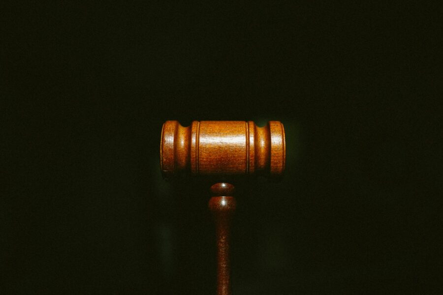 brown wooden stand with black background
