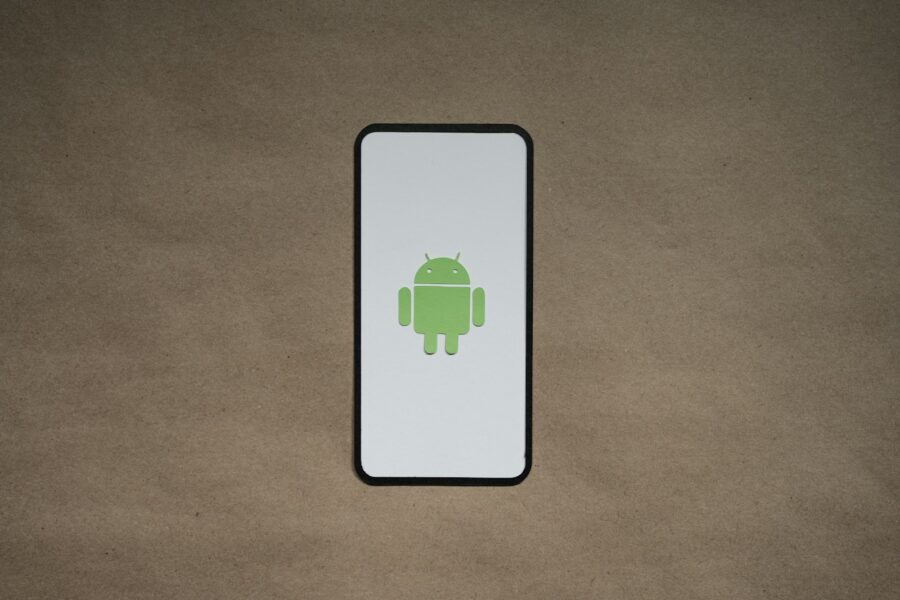 a cell phone with a green icon on it