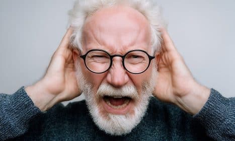 ai generated, elderly, senior, aging, emotions, expressive, gesturing, glasses, spectacles, sweater, hands, ears, hearing, covering, stressed, frustrated, reaction, mature, wisdom, experienced, energy, dynamic, dramatic, closeup