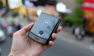 a person holding a smart phone in their hand