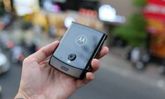 a person holding a smart phone in their hand