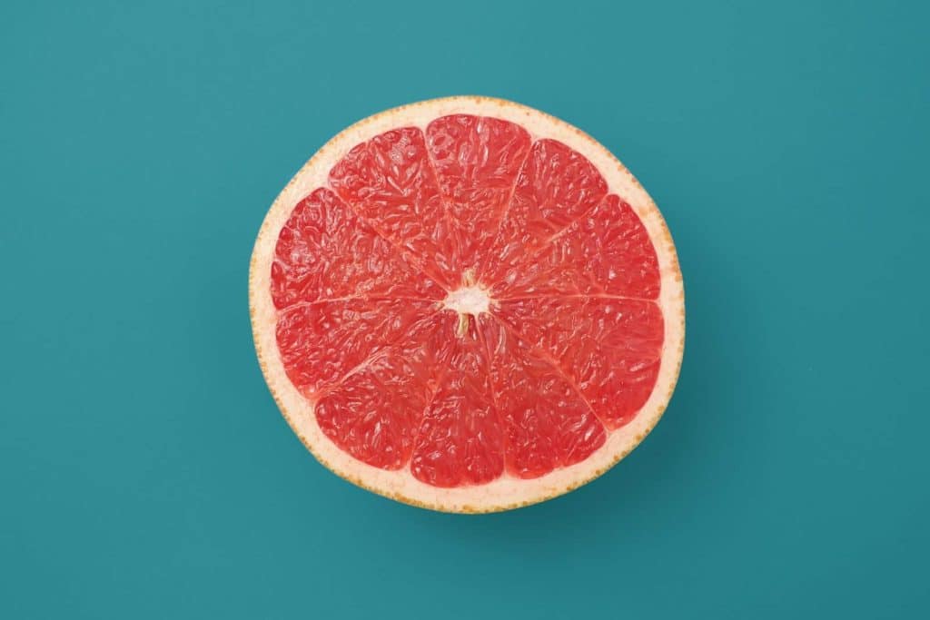 sliced orange fruit on blue background