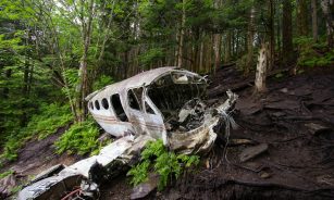 brown wooden canoe on brown soil