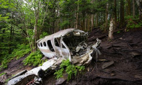 brown wooden canoe on brown soil