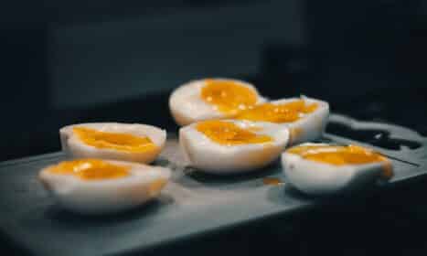 hard boiled eggs are sitting on a tray