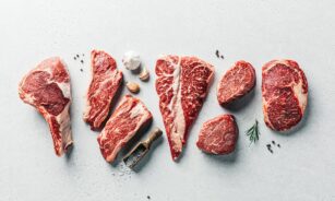 a group of raw meats on a table