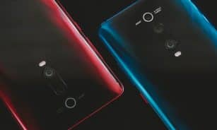 black huawei android smartphone with red case