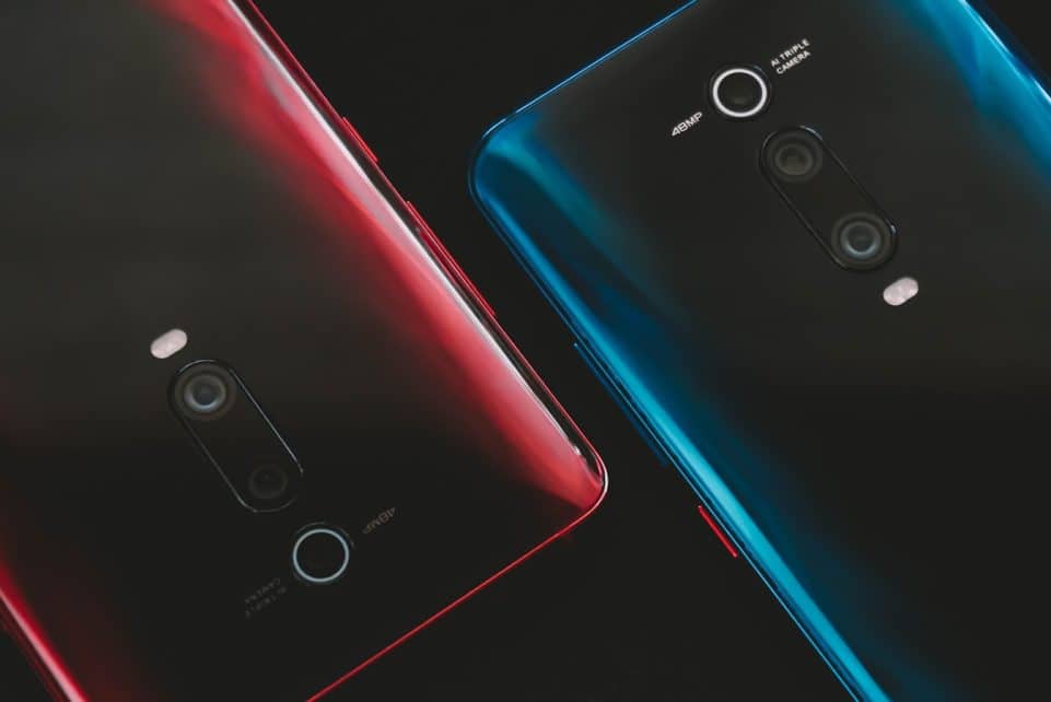 black huawei android smartphone with red case