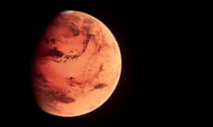 a red planet with a black background