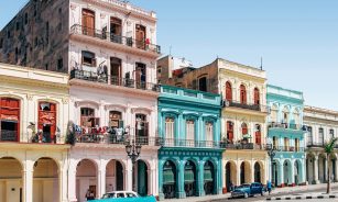 two cars parked outside building