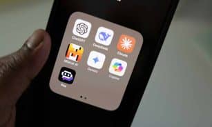 A person holding a smart phone in their hand