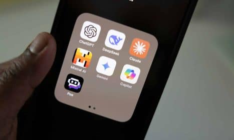 A person holding a smart phone in their hand