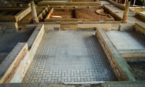 A group of wooden benches sitting next to each other