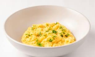 a close up of a bowl of food on a table