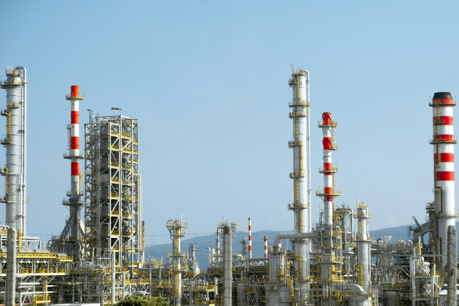 A factory with a lot of red and white pipes