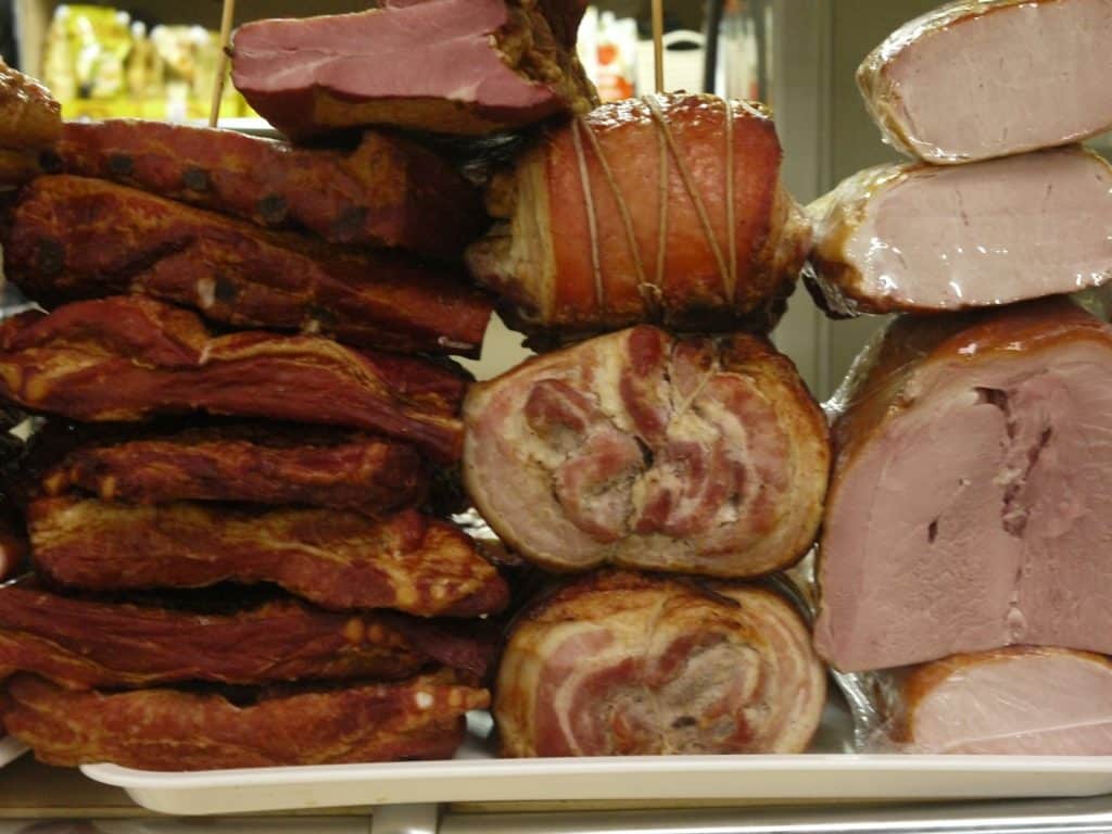 Stack of various cured and smoked meats