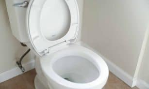 white ceramic toilet bowl with cover