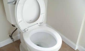 white ceramic toilet bowl with cover