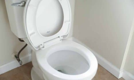 white ceramic toilet bowl with cover