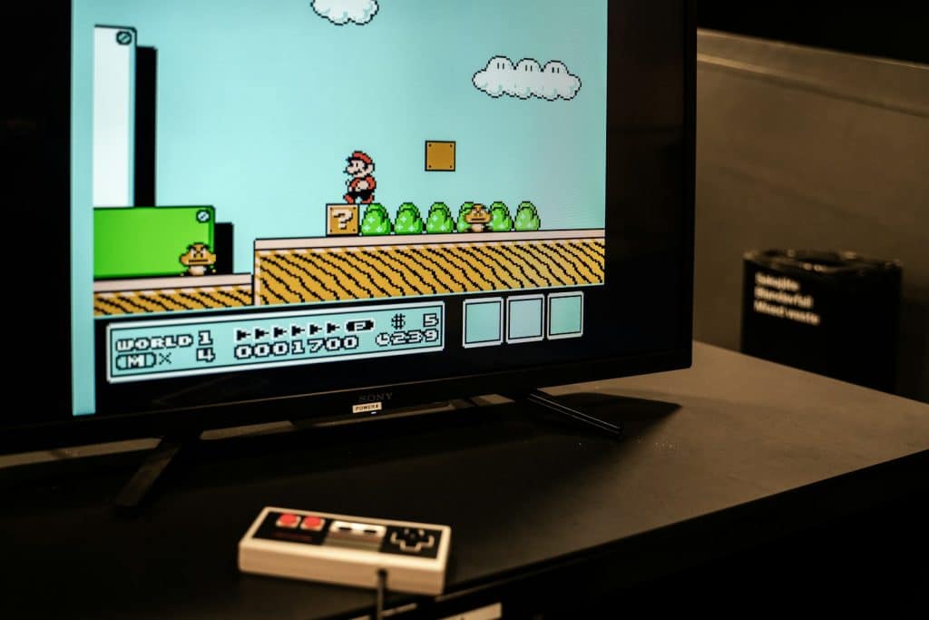 a flat screen tv sitting on top of a table