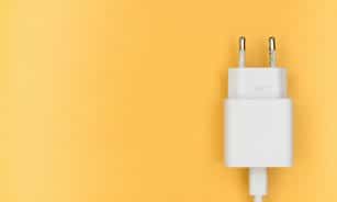 white adapter on yellow wall
