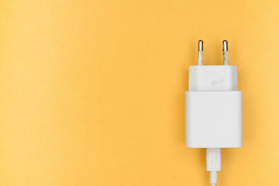 white adapter on yellow wall