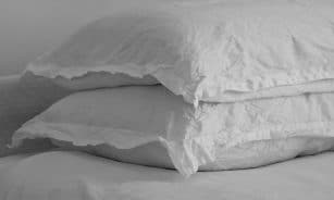white bed pillow on bed
