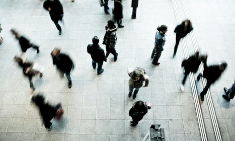 people walking on grey concrete floor during daytime