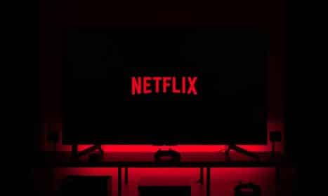 flat screen television displaying Netflix logo