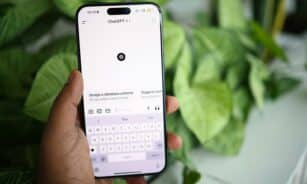 a person holding a cell phone in their hand