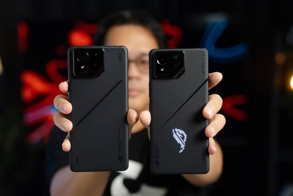 A woman holding two samsung phones in her hands