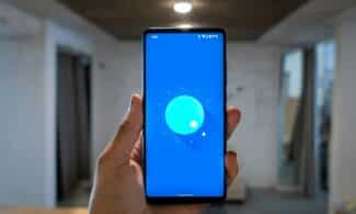 person holding blue ipod touch