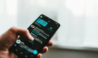 person holding black android smartphone