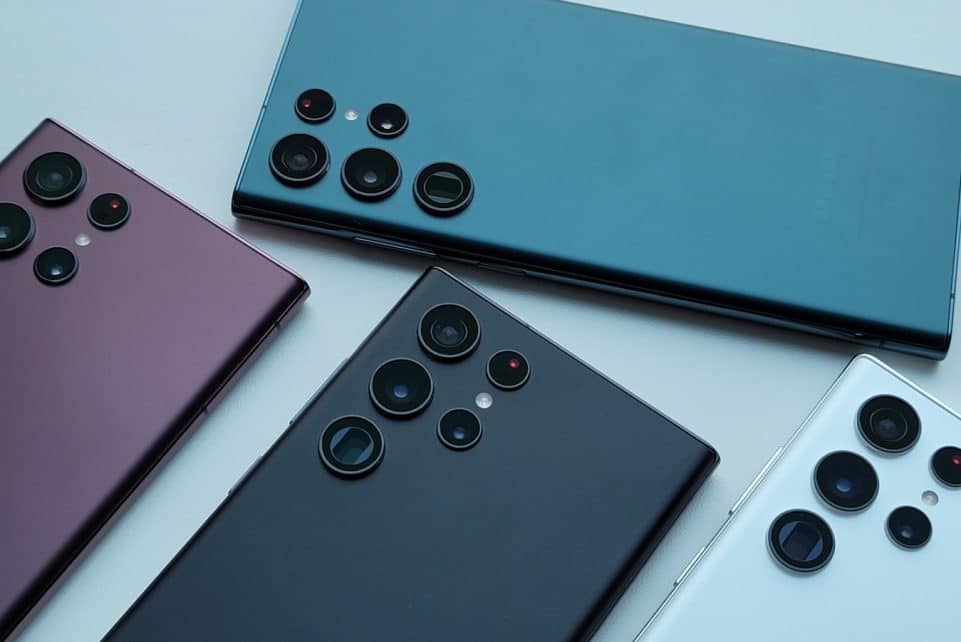 a group of four different colored cell phones