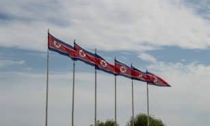 red and white flags on poles