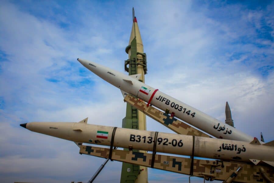 A group of fighter jets sitting on top of each other