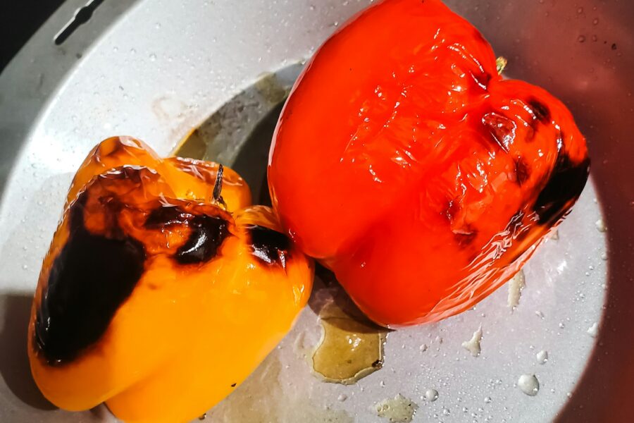 Roasted bell peppers in a pan.