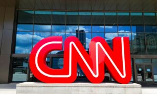 the cnn logo is displayed in front of a building