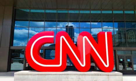 the cnn logo is displayed in front of a building