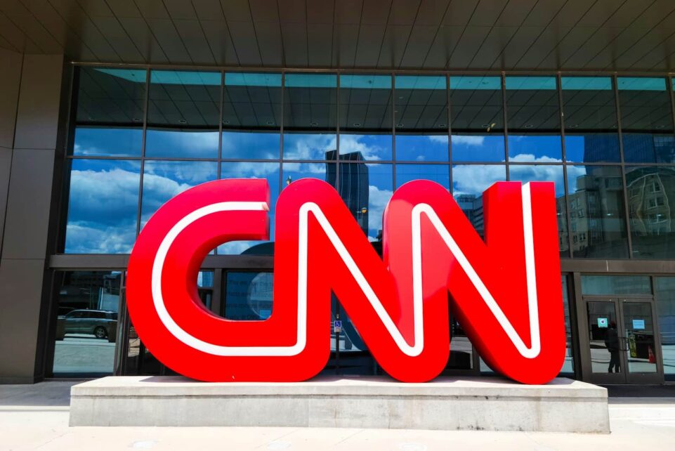the cnn logo is displayed in front of a building