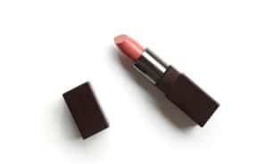 red lipstick on white surface